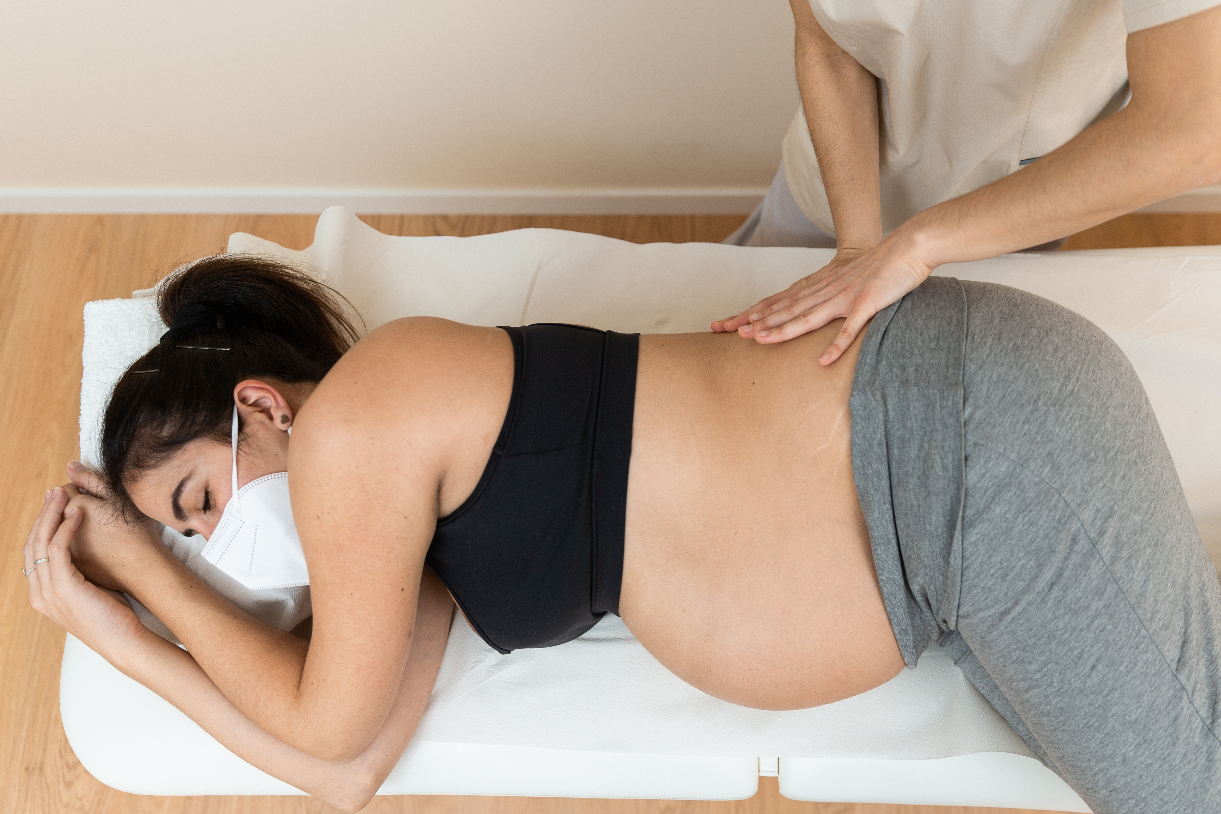 Remedial massage therapist treating pregnant woman at WA Health Group