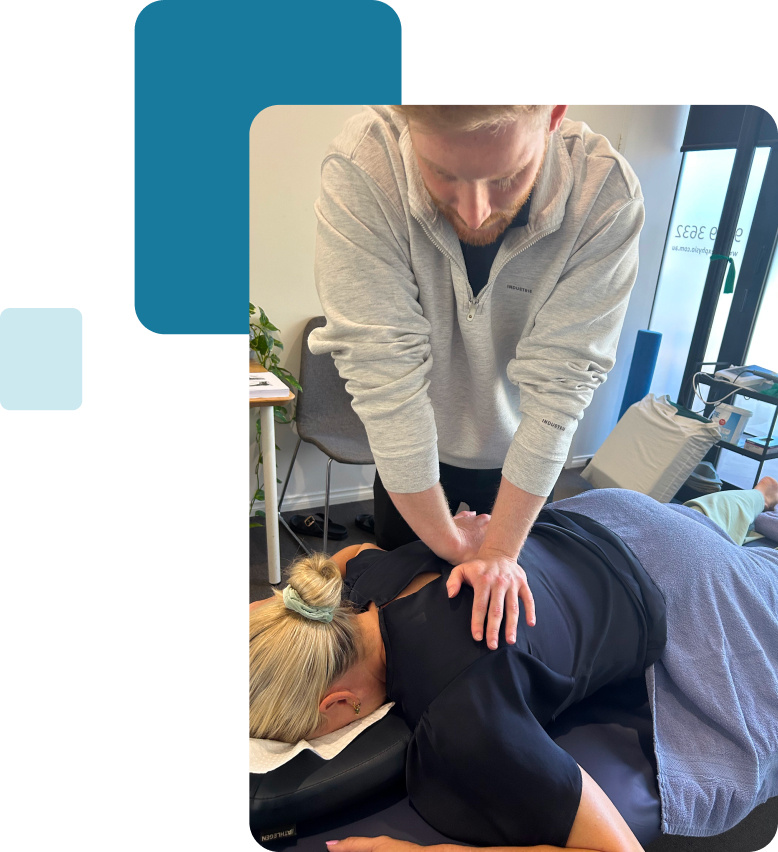 Physio helping a patient with back pain at Apex physiotherapy