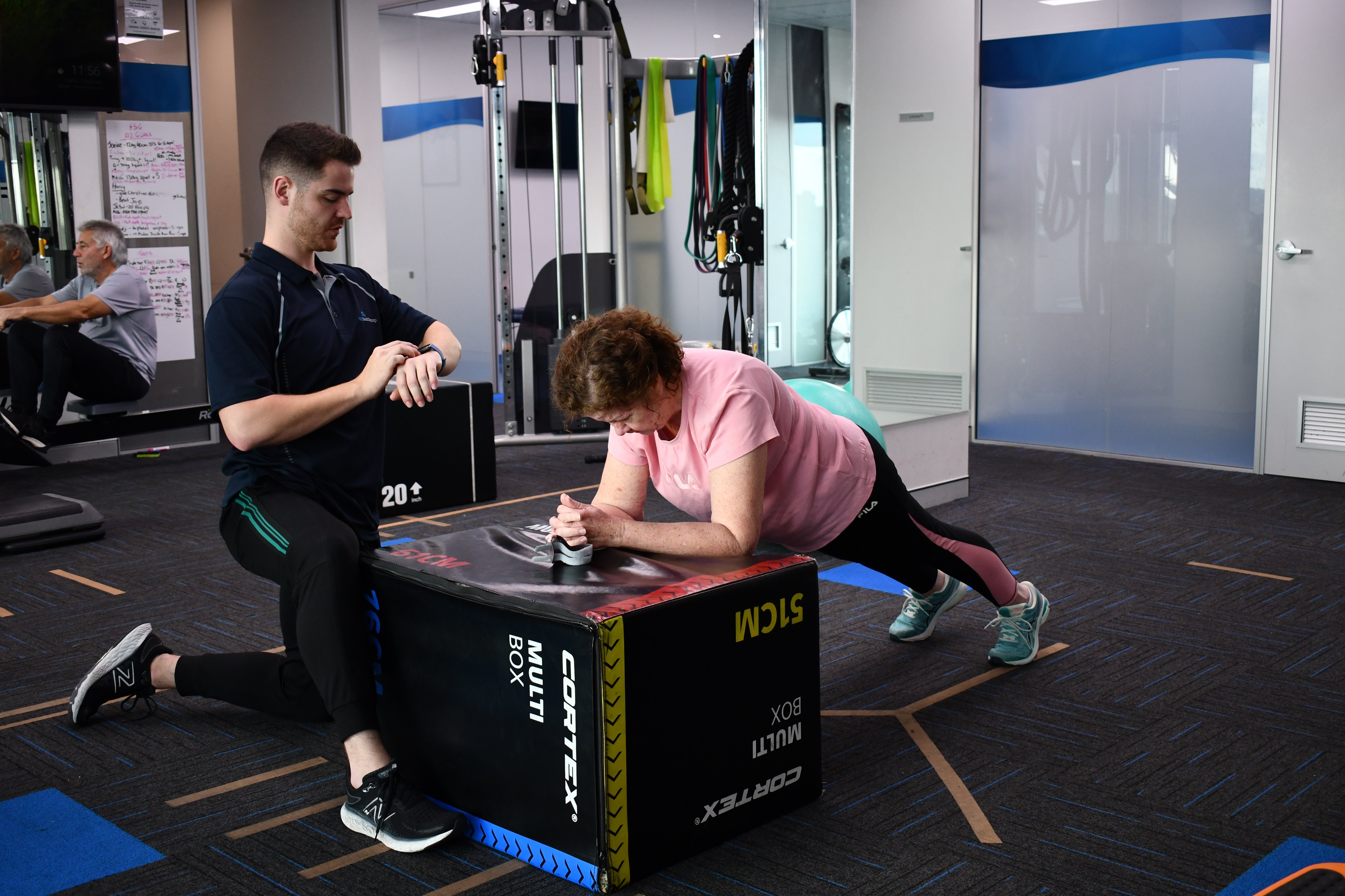 Exercise physiologist helping patient at WA Health Group