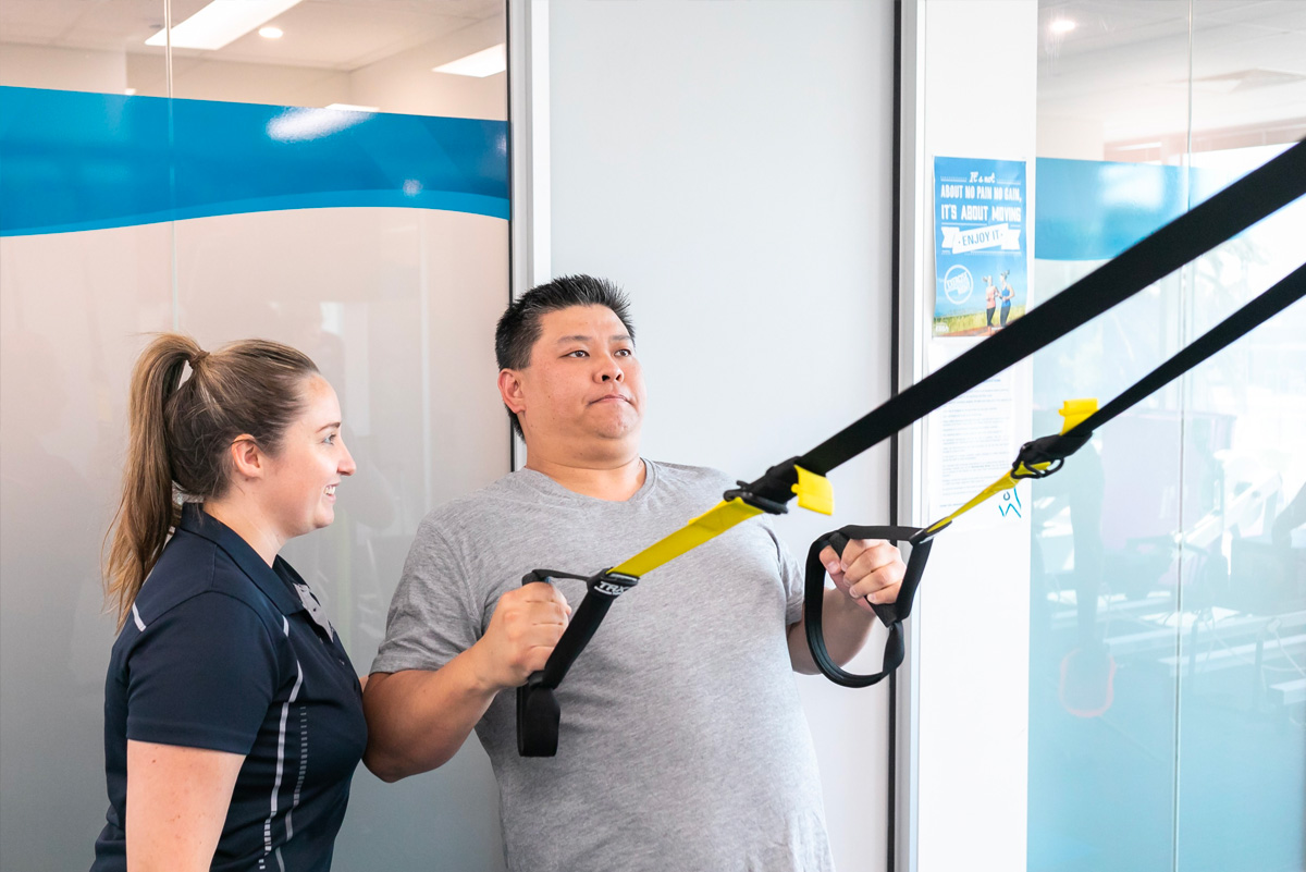 Clinician treating a busy professional at WA Health Group