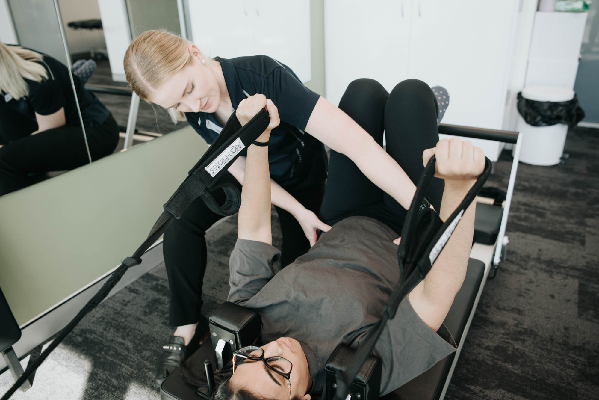 Physio conducting clinical pilates class at WA Health Group